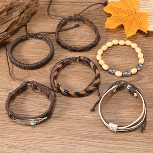 Close-up of Bohemian 6-piece bracelet set with turquoise beads and feather charms