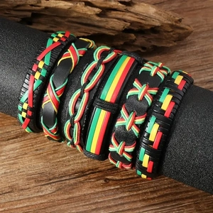 Close-up of bohemian leather bracelets with red, yellow and green braided cord details