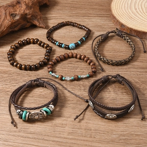 Vintage sunflower bull head multi-layer leather bead bracelets set on wooden background