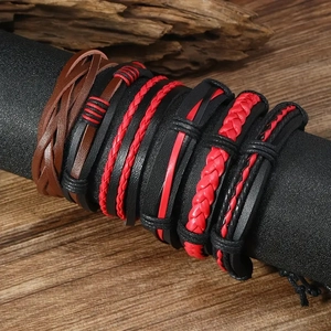 Detail view of multi-layer leather bracelets on a wooden display with vintage styling