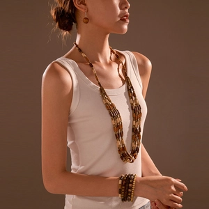 Retro 3-piece wooden jewelry set featuring multi-layer cross necklace and beaded bracelets