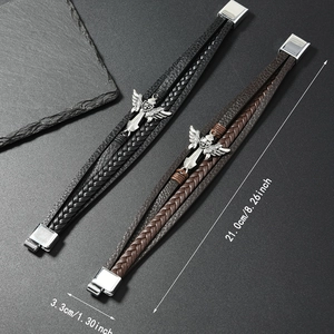 Detail shot of multi-layer braided leather bracelet with sword and wing charm detail