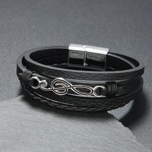 Multi-layer leather music note bracelet with silver treble clef and magnetic clasp
