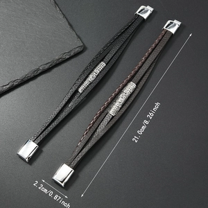 Detail showing 21cm length of black and brown leather Viking bracelets with magnetic clasp