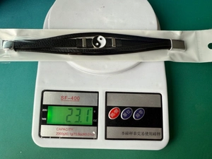 Weight measurement of a leather Tai Chi bracelet showing 23.1 grams on a scale