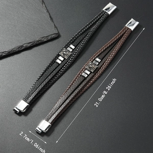 Detail view of multi-layer braided leather skull bracelet with magnetic clasp size specs