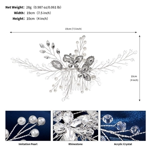 Detailed view of silver bridal hair comb with crystal butterflies and pearls for wedding.