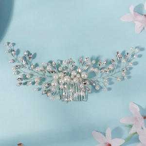 Detail of bridal hair comb with white pearls, marquise rhinestones and silver wire work