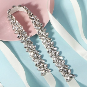 Close-up of bridal belt with marquise rhinestones on white satin ribbon