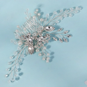 Detail of silver wedding hair comb with crystal marquise gems and white pearls