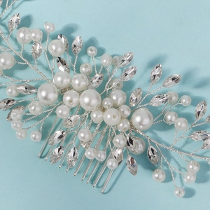Elegant bridal hair comb with white pearls and marquise crystals on silver floral branches