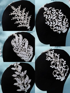 Detail of silver bridal hair combs with cubic zirconia in nature inspired designs