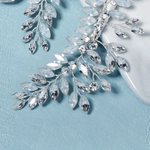 Exquisite bridal hair clip with crystal leaf design and silver wire weaving for weddings