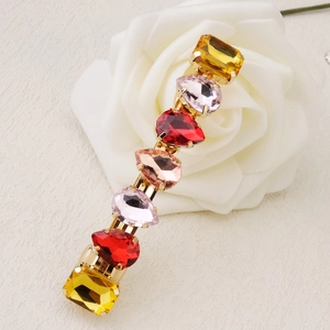Elegant candy-colored gemstone hair clip with colorful crystals on a gold metal base