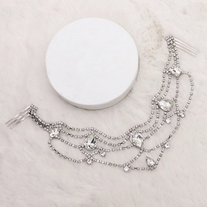 Close-up of luxury bridal hair chain with sparkling rhinestones and teardrop zircons