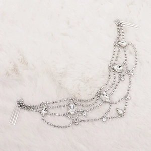 Elegant silver bridal headpiece with pear-cut rhinestones and hair combs on faux fur