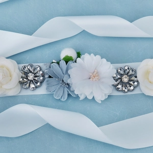 Elegant bridal sash with handmade fabric flowers and sparkling rhinestones on white ribbon