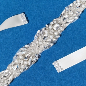 Luxurious bridal sash with sparkling crystals and white pearls on white satin ribbon