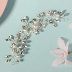 Elegant handmade bridal hair vine with white pearls and sparkling crystal rhinestones