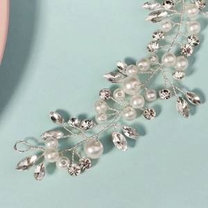 Handmade silver hair vine with white pearls and sparkling crystals for bridal hairstyles