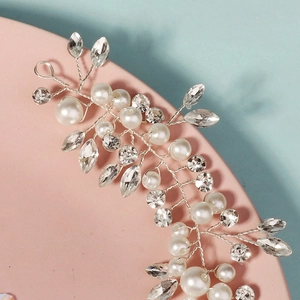 Handmade silver bridal headband with white pearls and sparkling crystal vine floral design