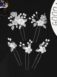 Detail of 5-piece silver bridal hair pins with frosted flowers and white beads