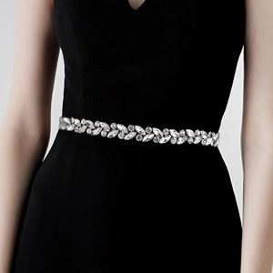 Detail of bridal belt showing marquise cut rhinestones and crystals on black dress