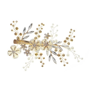 Detail view of handmade flower hair clip with cream pearls and gold metallic wire