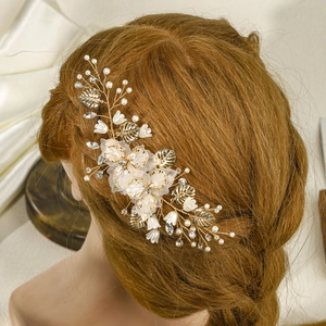 Handmade bridal hair comb with gold leaves, white flowers and faux pearls for weddings