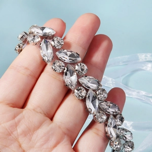 Handmade bridal belt featuring sparkling marquise and round rhinestones on a mesh base