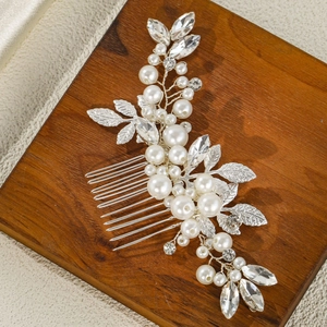 Elegant bridal hair comb with silver leaves, white pearls and sparkling rhinestones