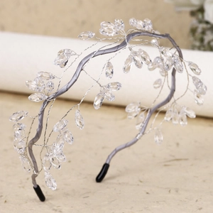 Detailed view of handmade silver crystal bridal headband with delicate beaded leaves
