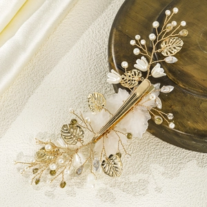 Elegant gold bridal hair clip with white shell flowers, pearls and golden leaves