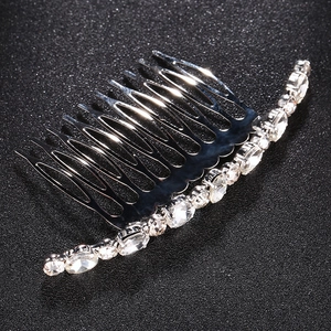 Detail of silver hair comb with ten teeth and sparkling rhinestones for bridal hairstyles