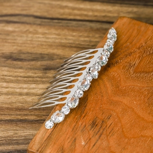 Elegant silver hair comb with sparkling rhinestones for wedding and bridal hairstyles