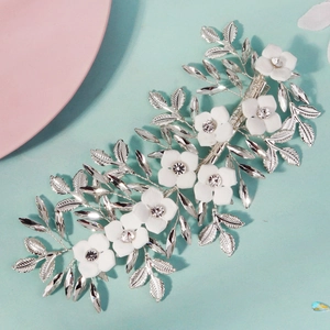 Elegant white floral bridal hair clip with pearls and rhinestones for wedding styling