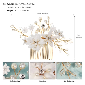 Detailed view of handmade bridal hair comb with pearls, crystals, and white floral accents