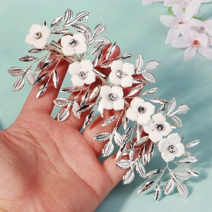 Exquisite bridal hair clip with white resin flowers and crystals on silver vine wire