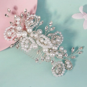 Elegant silver hair comb with white pearls and sparkling rhinestones for bridal hairstyles