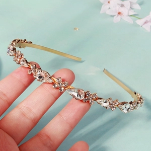 Elegant gold headband with sparkling teardrop rhinestones for bridal and party hairstyles