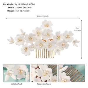 Handmade bridal hair comb with pearl flowers and dimensions of 12.5cm by 7cm