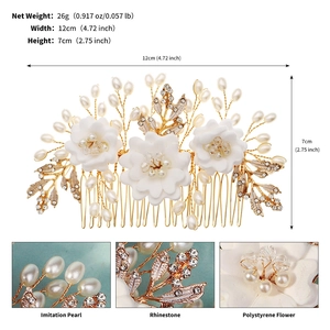 Detailed view of white clay flowers, faux pearls, and rhinestones on bridal hair comb