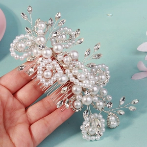 Handmade bridal hair comb with elegant white pearls and sparkling rhinestones for weddings