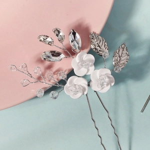 Handmade white ceramic flower hair pin with silver leaves and crystal beads for bridal hair
