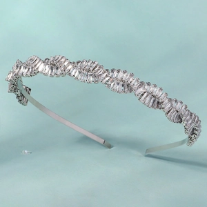 Macro shot of silver wave headband featuring detailed baguette-cut zircon crystals