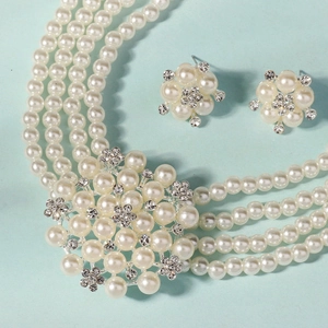 Luxurious multi-layer pearl necklace and floral earrings set for wedding attire
