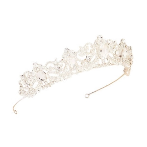 Detail of silver alloy wedding tiara showing intricate hollow patterns and clear rhinestones
