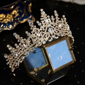 Close-up of luxury bridal tiara with sparkling rhinestones on vintage glass display box