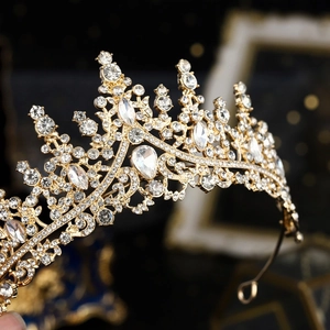 Luxurious gold bridal crown with pear-shaped cubic zirconia and sparkling rhinestones