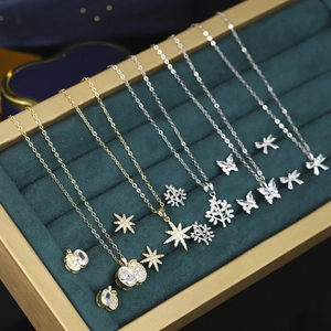 Elegant zircon necklace and earring set featuring geometric star and butterfly designs